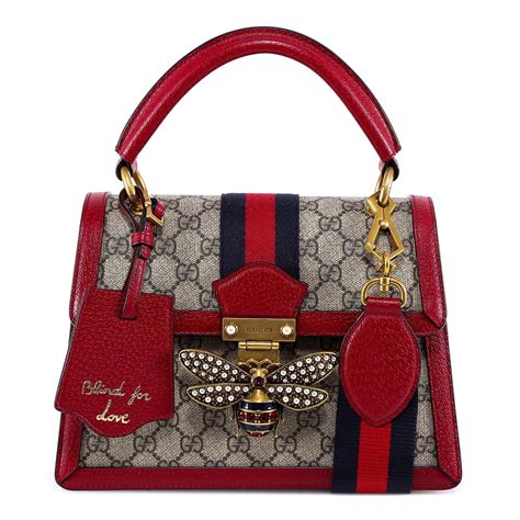 gucci purse with bee clasp.